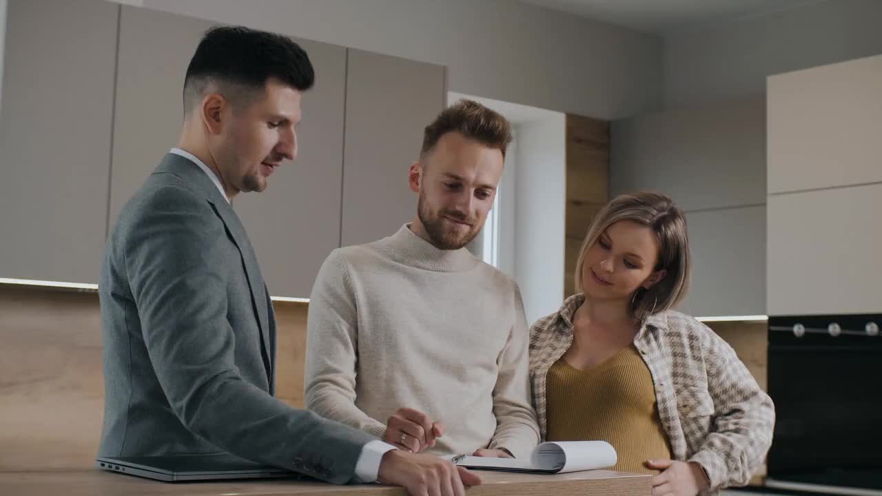 Tenant signing a rental agreement with a Property 360 representative.