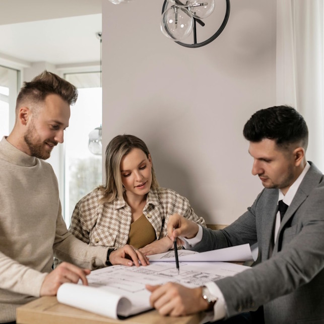 Property 360 leasing agent reviewing rental agreement with tenants.